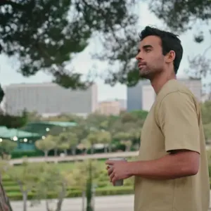 Man standing thoughtfully in a park, showcasing the journey of recovery through Alcohol Detox in Nashville for a healthier future.