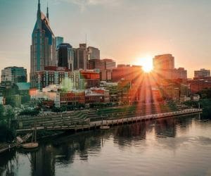 Man standing thoughtfully in a park, showcasing the journey of recovery through Alcohol Detox in Nashville for a healthier future.