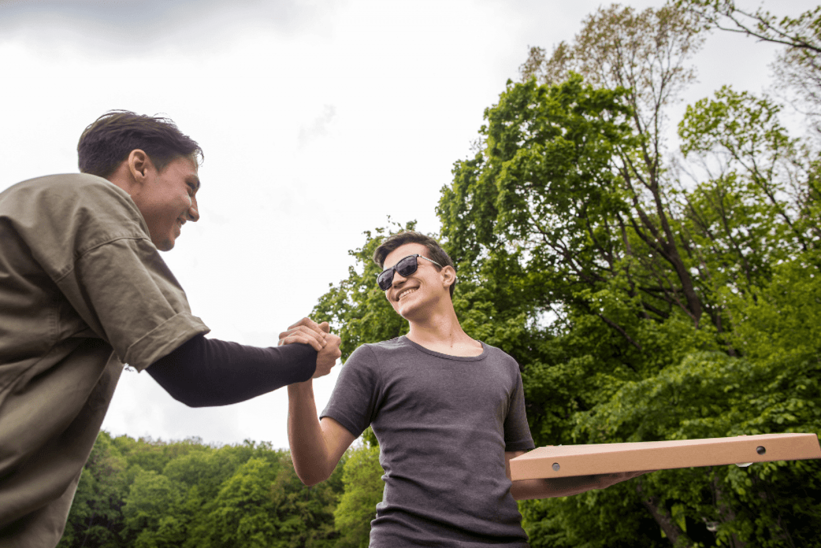 Two individuals enjoying a positive moment outdoors, showcasing the fresh start possible with Rapid Detox in Nashville.