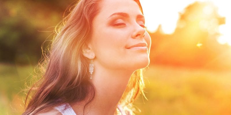 Person showing relief during recovery from alcohol addiction treatment
