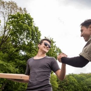 Two individuals enjoying a positive moment outdoors, showcasing the fresh start possible with Rapid Detox in Nashville.